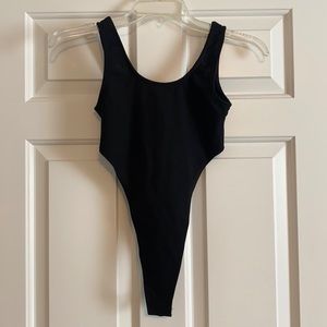 Never been worn very high cut bodysuit